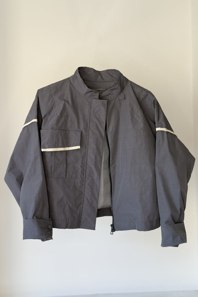 folded sleeves with fabric covered buttons